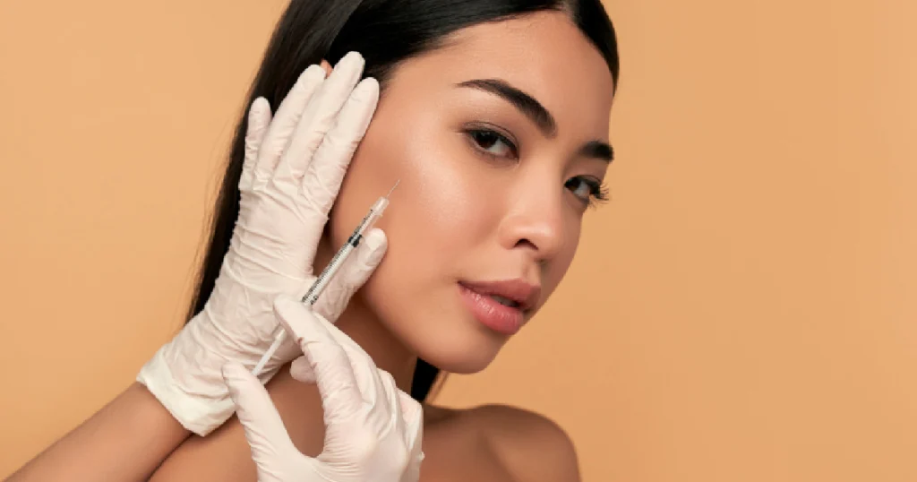 Woman receiving BOTOX and dermal filler injection from professional in Rochester Hills, MI