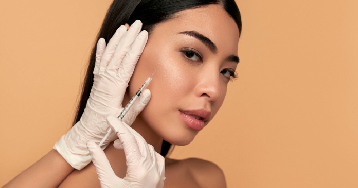 Woman receiving BOTOX and dermal filler injection from professional in Rochester Hills, MI
