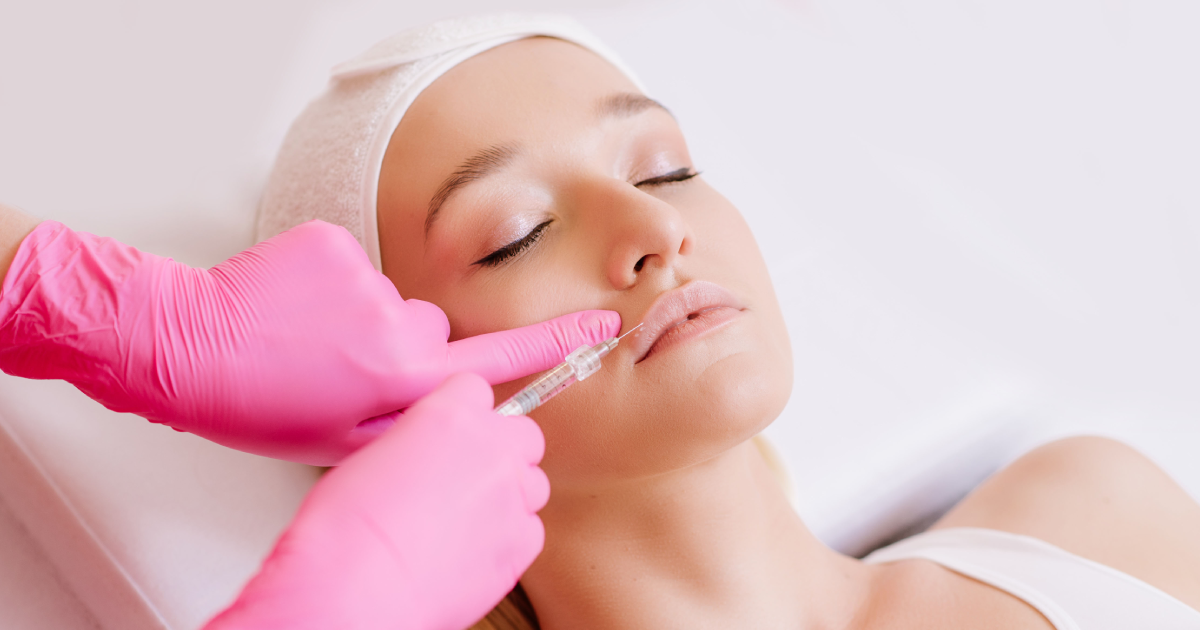 A woman receiving Belotero lip filler injection by a professional in Rochester Hills, MI