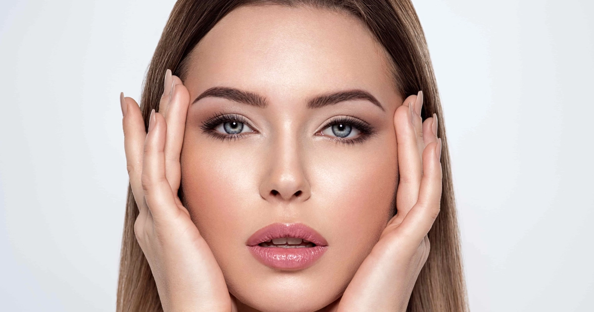 Woman with dramatic eye makeup framing her face, highlighting beauty and Diamond Glow Facial in Rochester Hills.